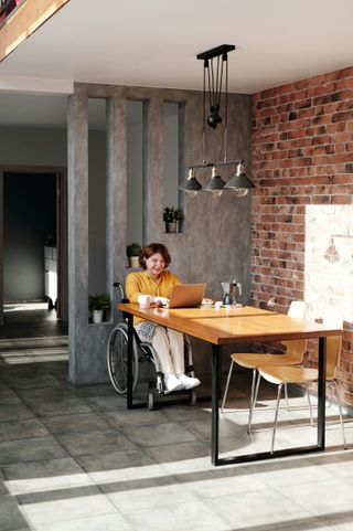 Confident woman in wheelchair holding a message card